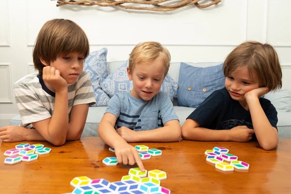 Kids playing Stello, a math game