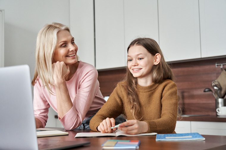 mom and daughter browsing eligible My Spark programs online