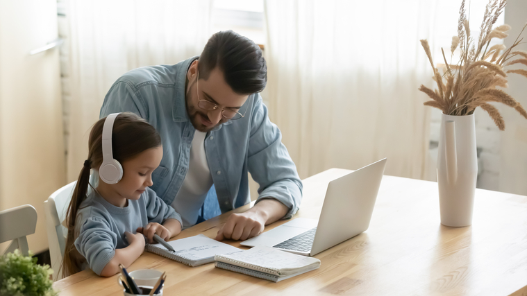 Dad helping his daughter with math homework