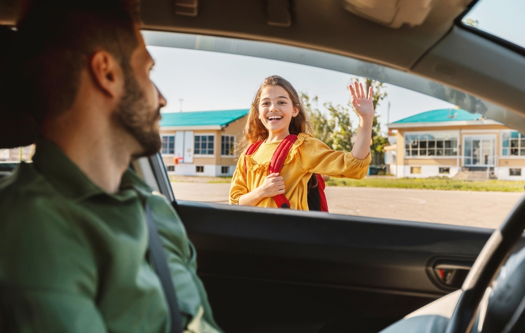 Father dropping off his daughter at class