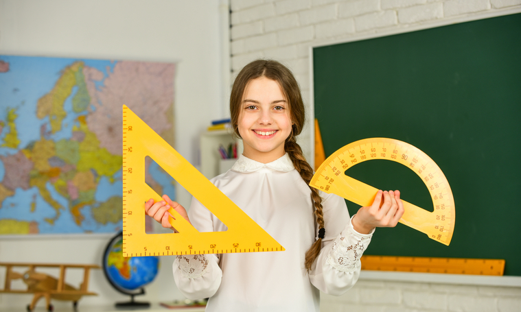 Math student learning geometry in her math class.