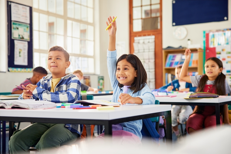 Children actively engaged in learning, demonstrating how curiosity leads to deeper understanding and a love for discovery in math