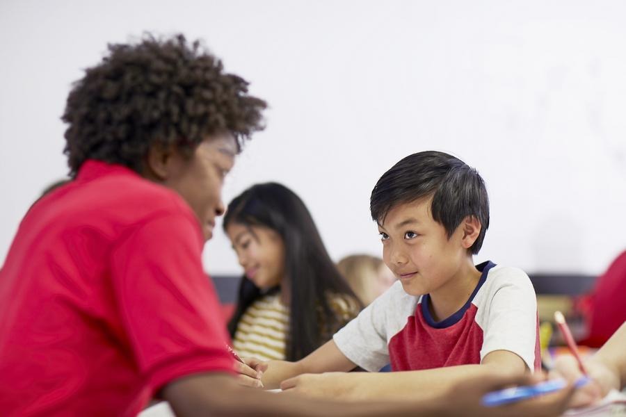 Mathnasium instructor providing one-on-one guidance to a student, reflecting how structured support helps build confidence and close learning gaps