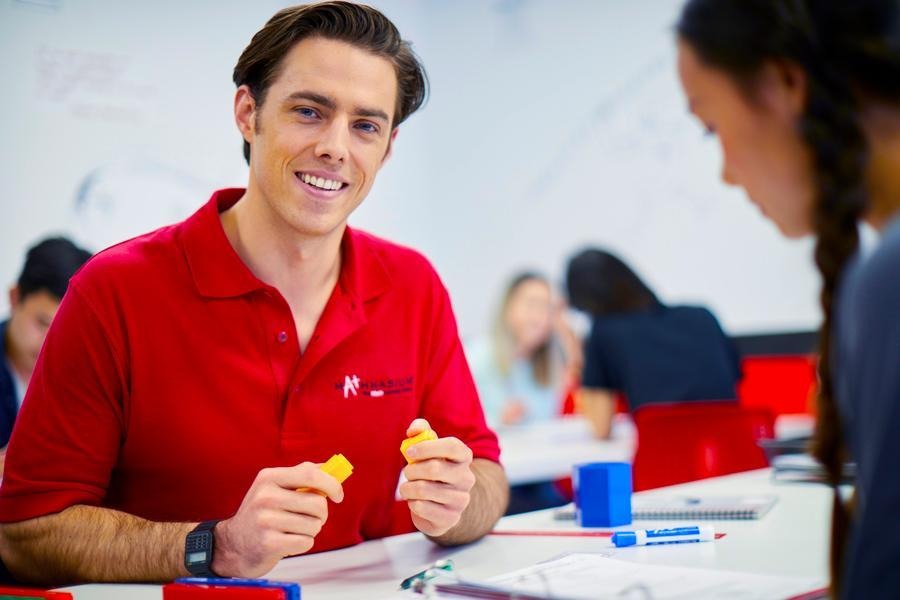 A Mathnasium tutor and student go over a math problem.