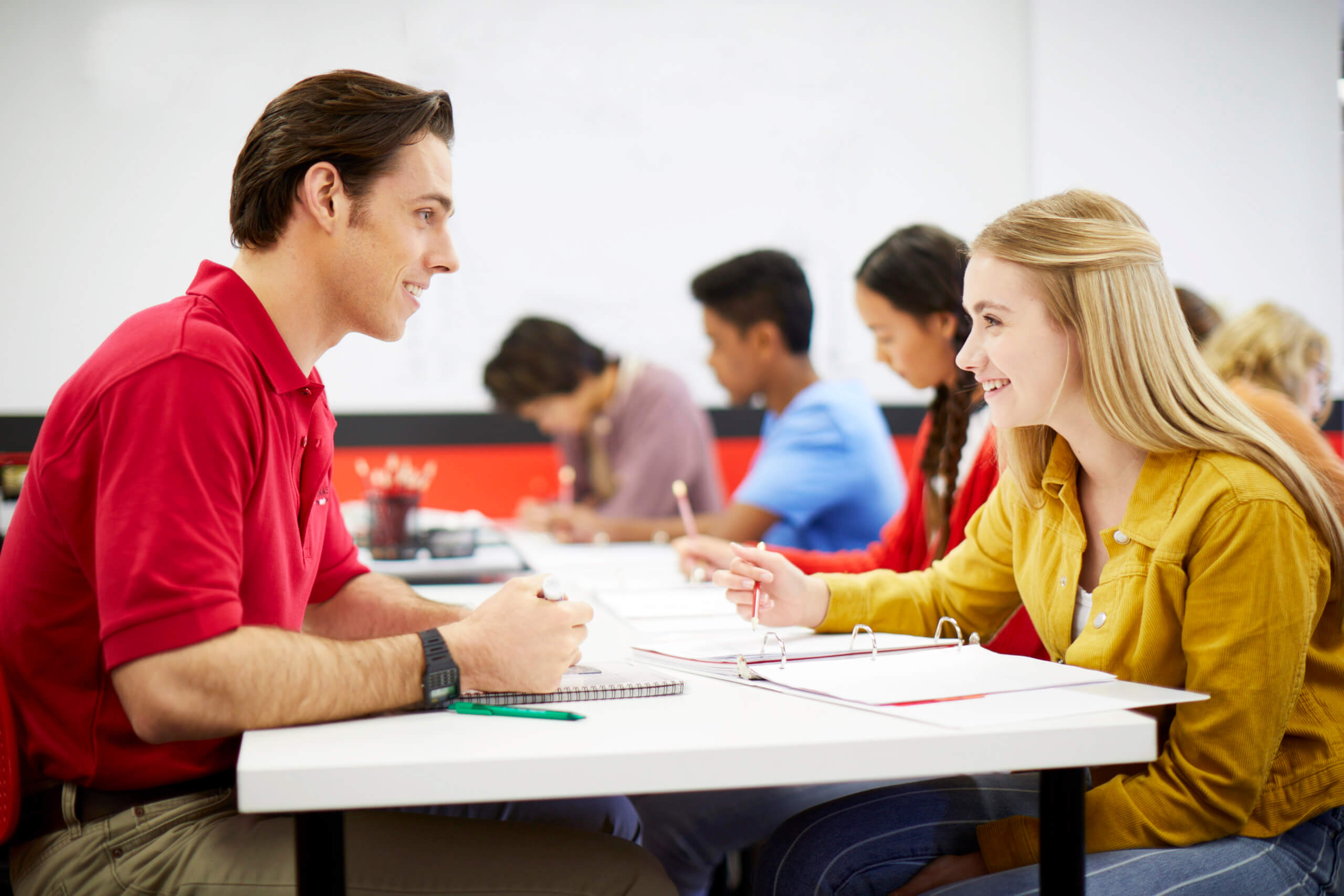 Mathnasium tutor explains math concepts to a student