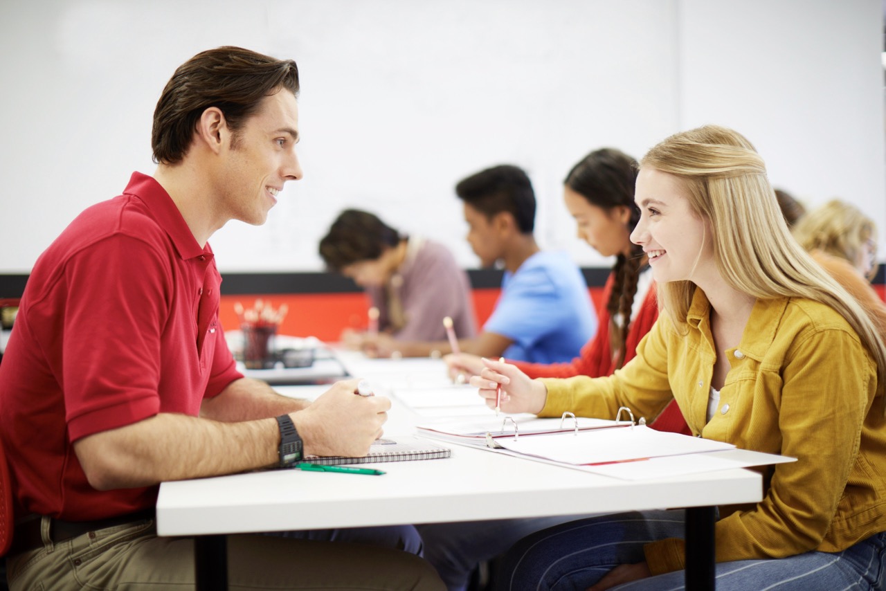 Mathnasium tutor explains math concepts to a student