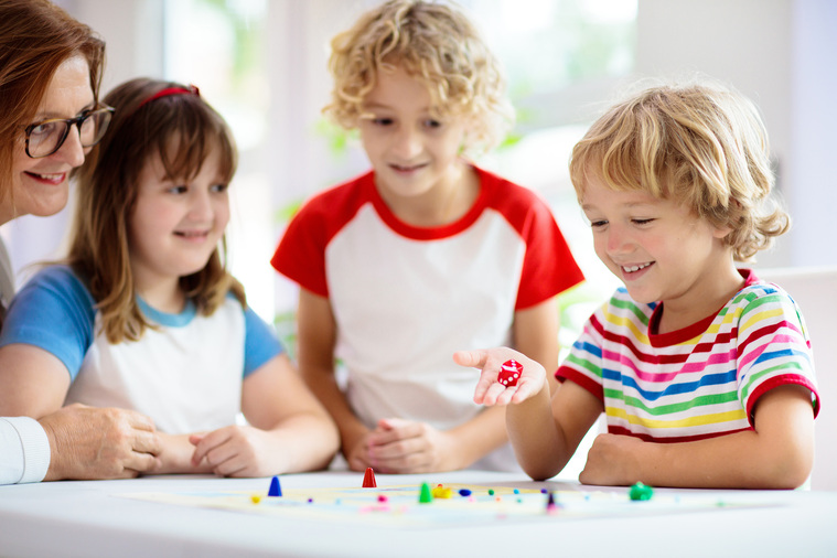 Two toddlers playing a dice game, learning to subitize
