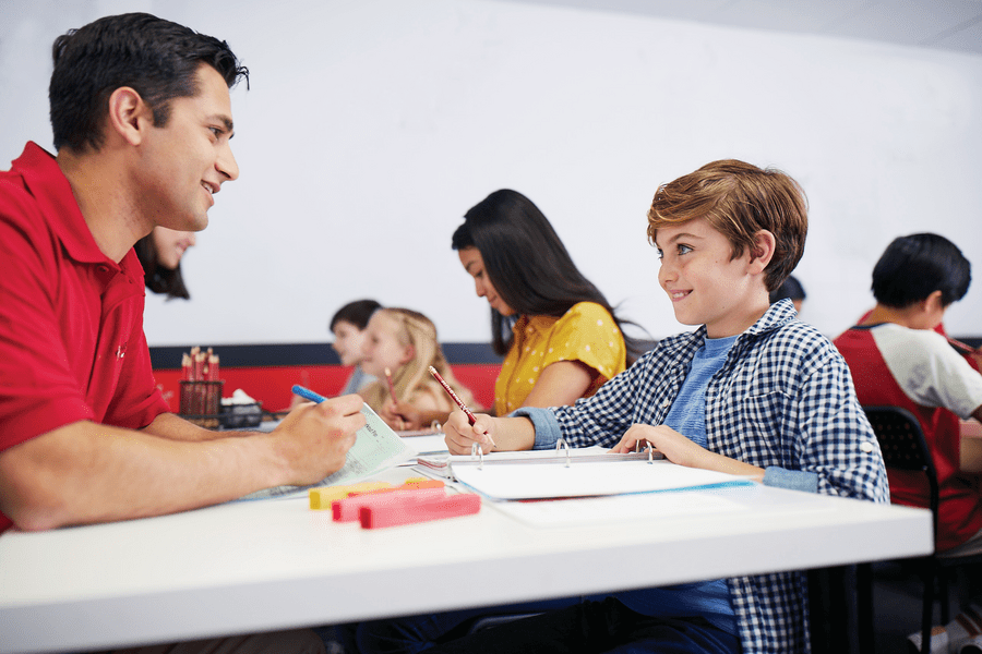 Mathnasium tutor helping a young student with their math problems