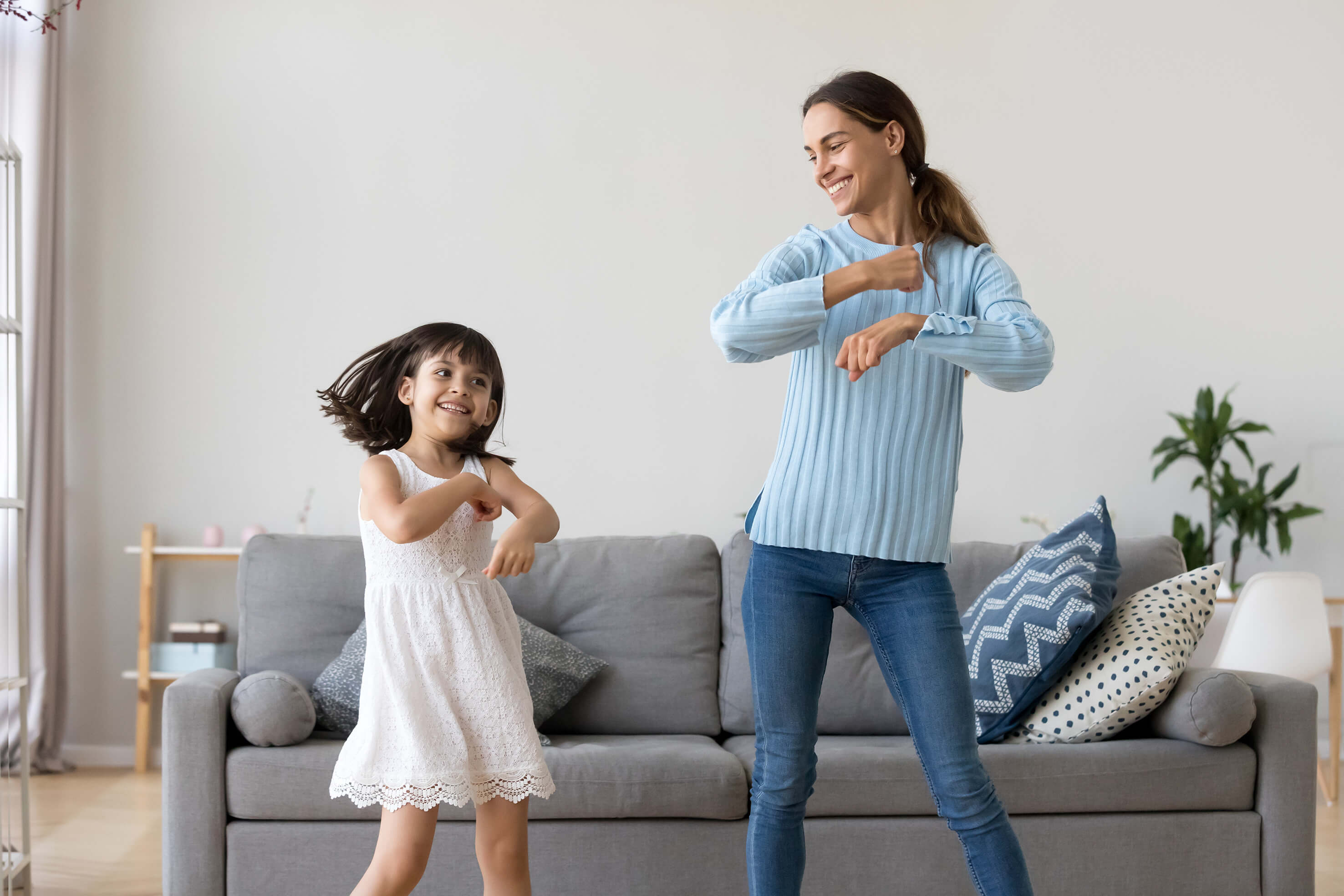 A mother and daughter dancing