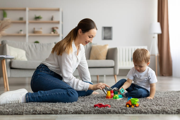 Mother and toddler grouping toys and practicing subitizing