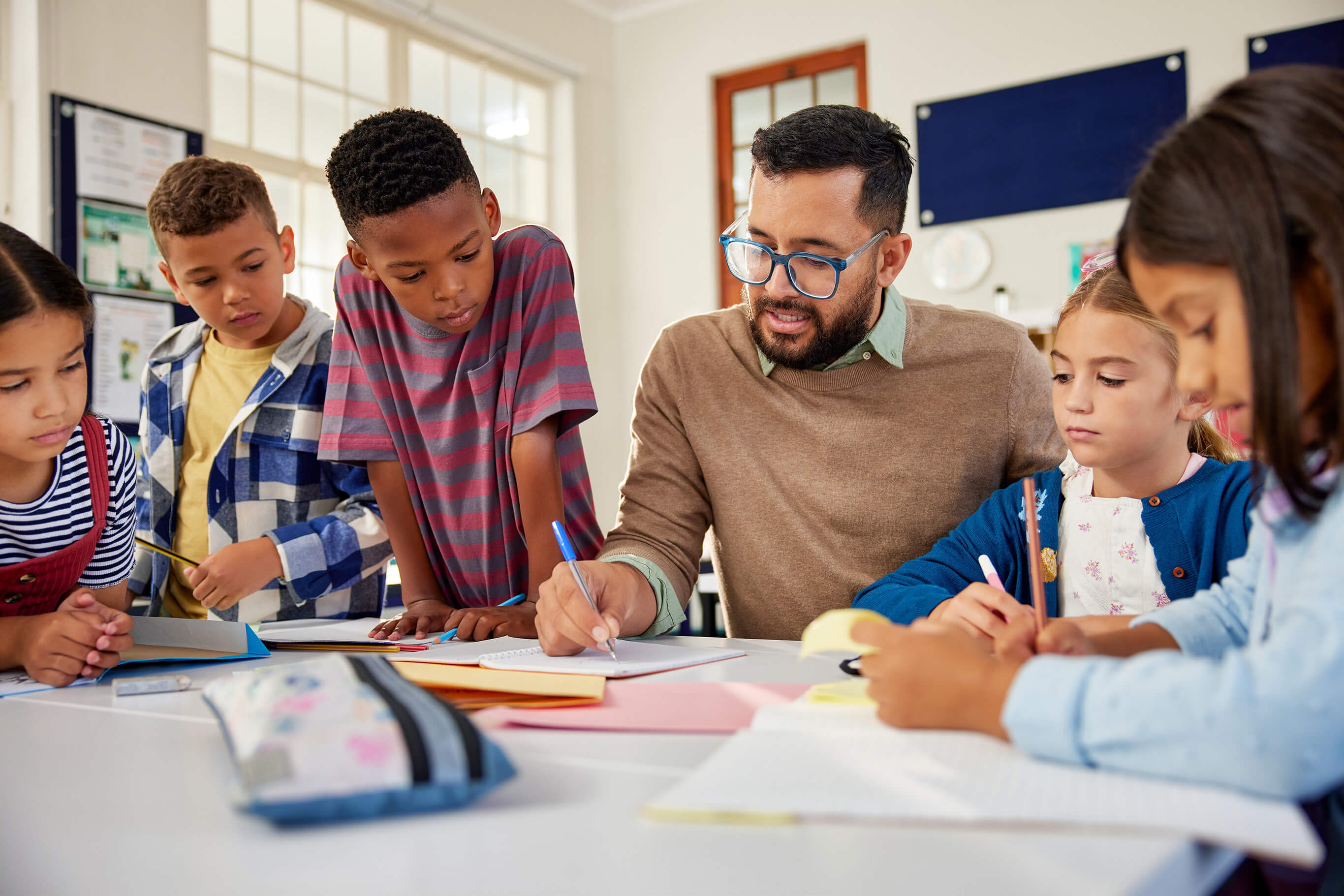 Math tutor explaining concepts to a group of children