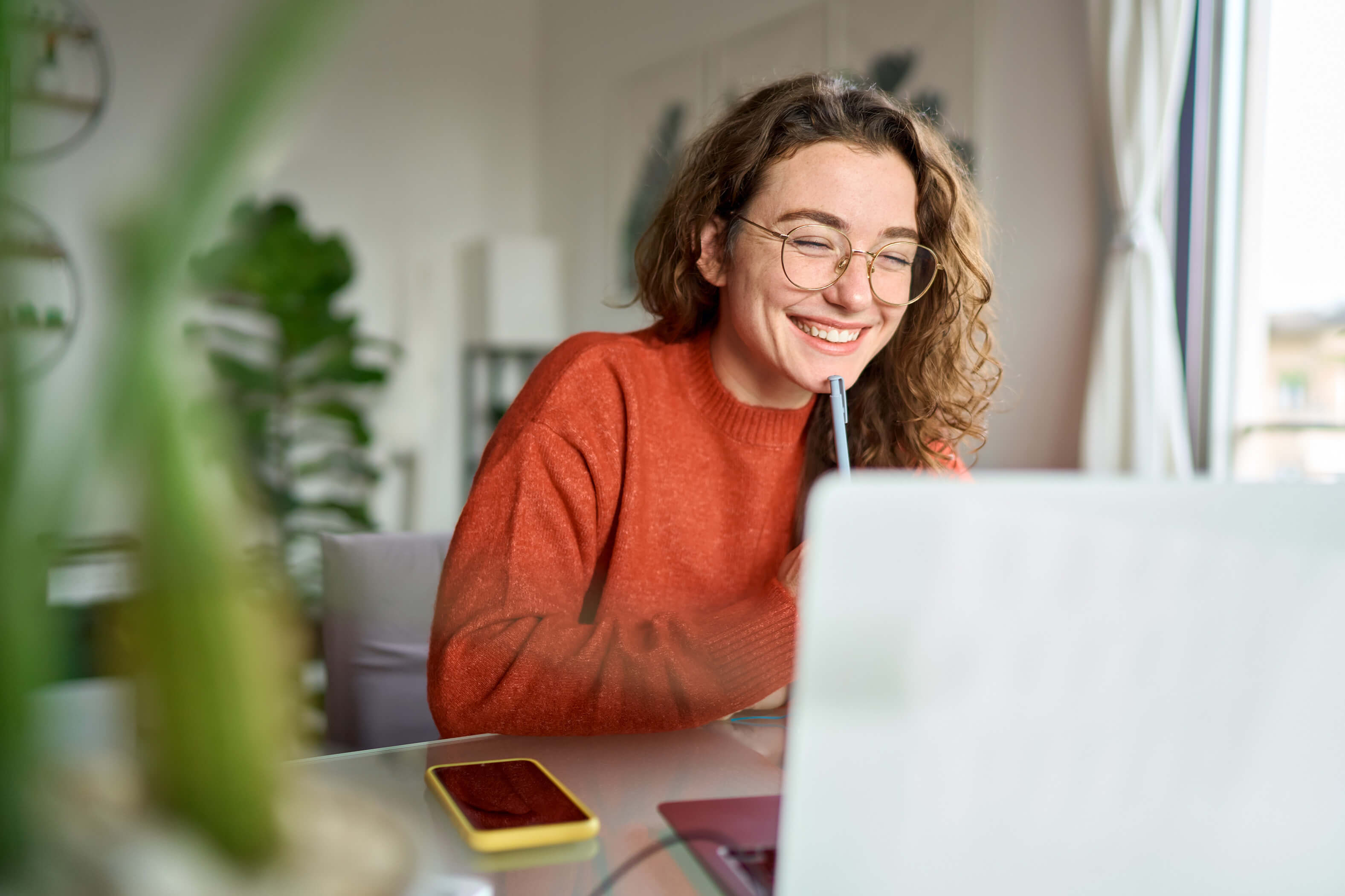 A woman smiling during online math session