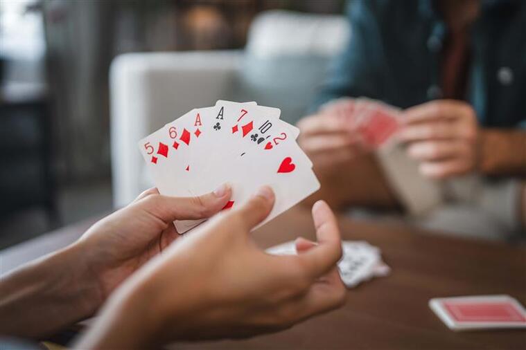 Students playing a game of cards, building number sense naturally