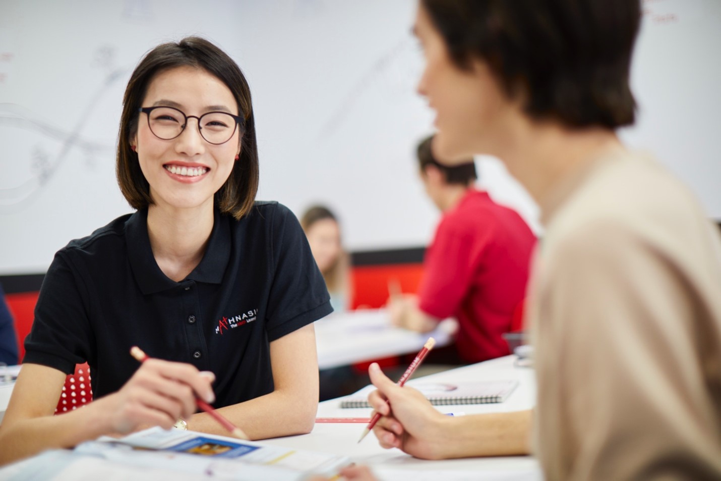 Mathnasium-instructor-smiling-while-tutoring-a-student.jpg