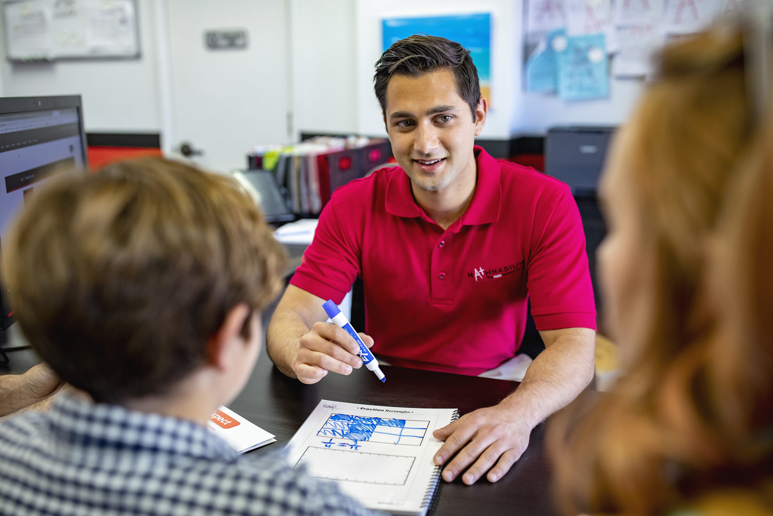 Math tutor guiding student and parents through customized learning plan