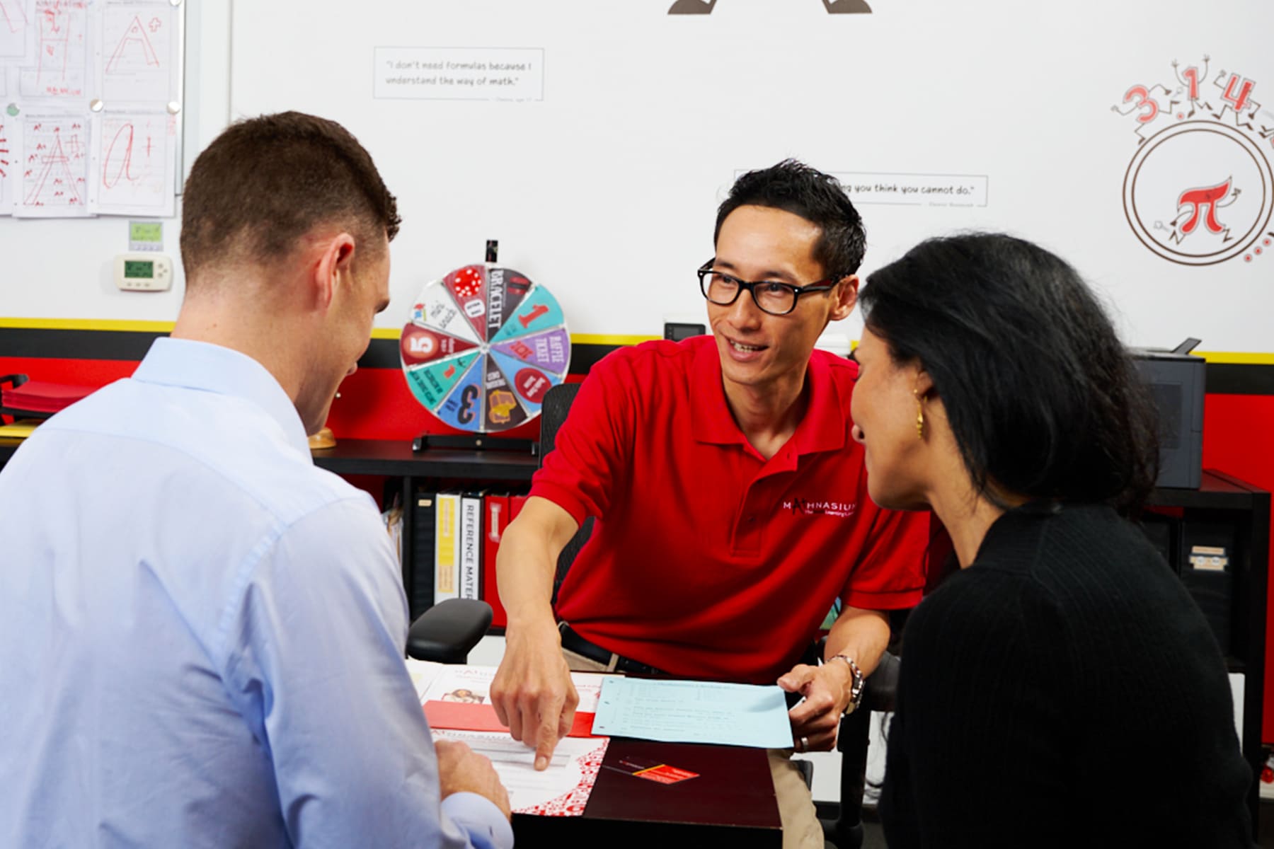A math tutor talking to parents