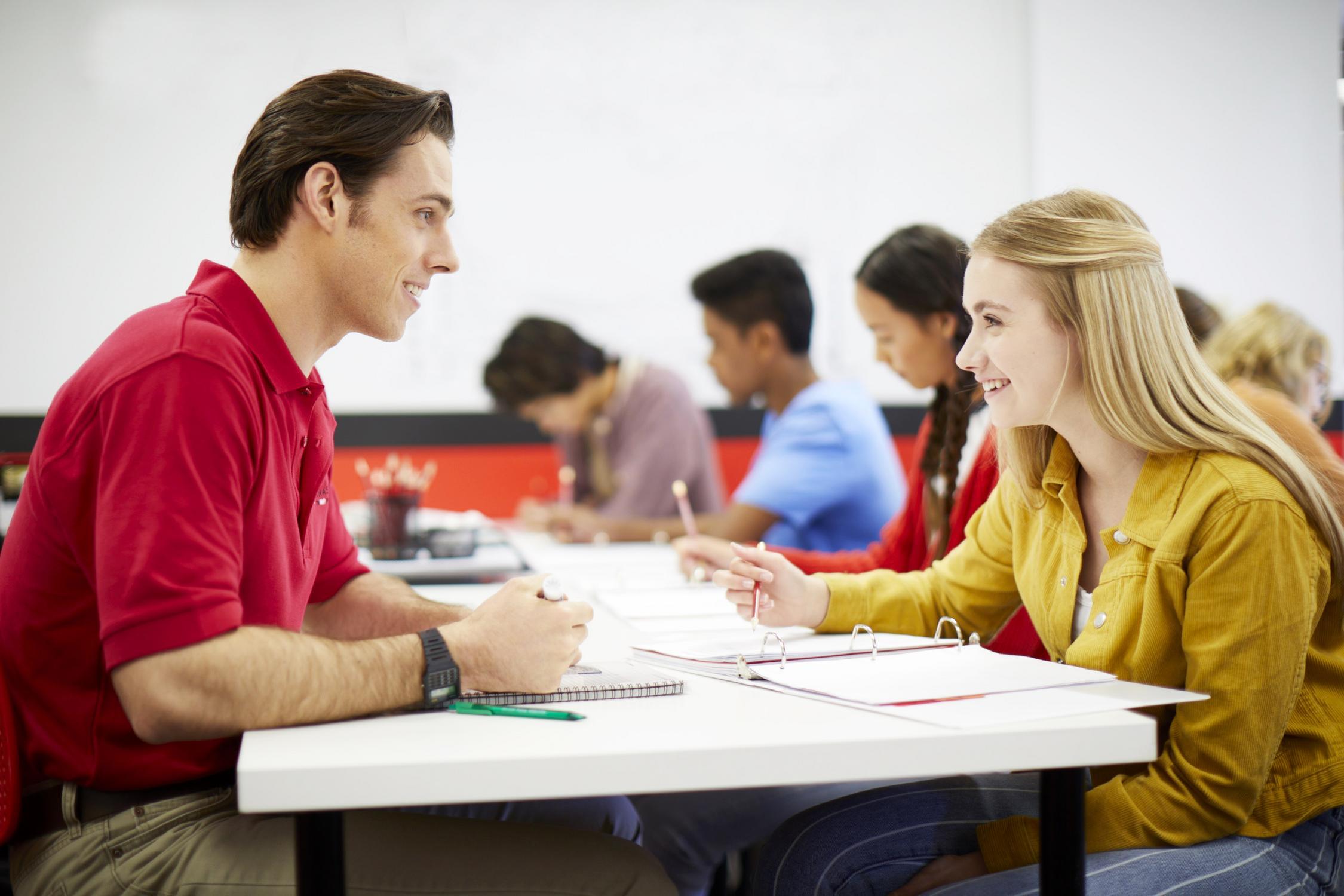 Mathnasium tutor working with a student on a math problem.