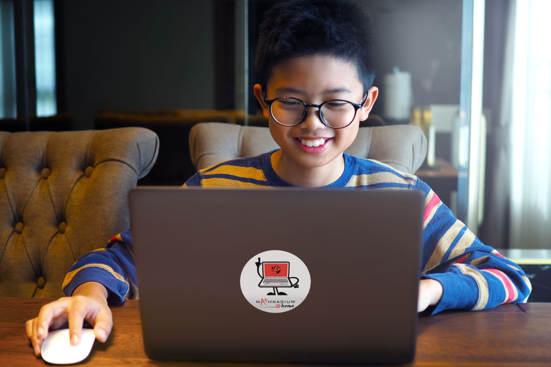 Student using laptop for virtual one-on-one math lesson with tutor