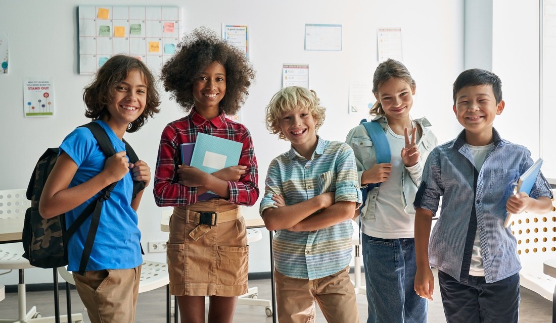 A group of math students in a classroom smiling