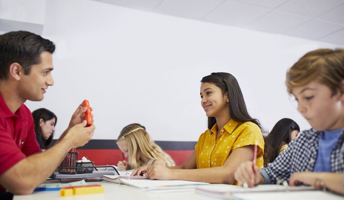 Students receiving personalized instruction from a Mathnasium instructor in a supportive, small-group learning environment.