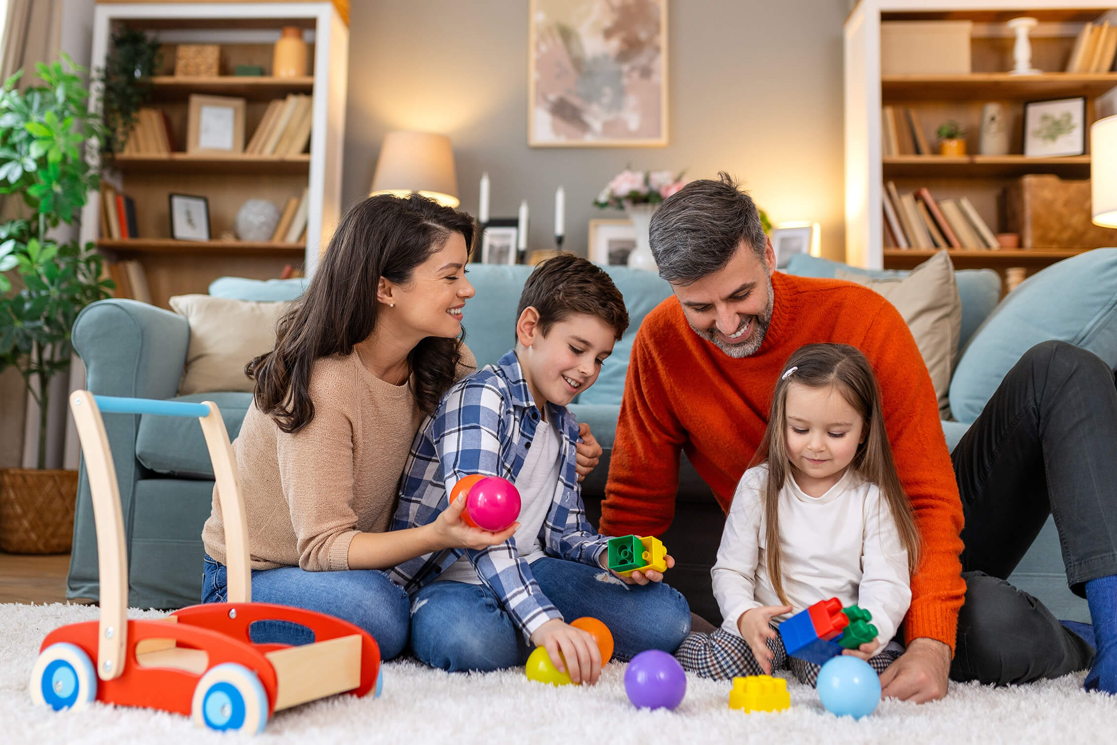 A family playing with colorful toys