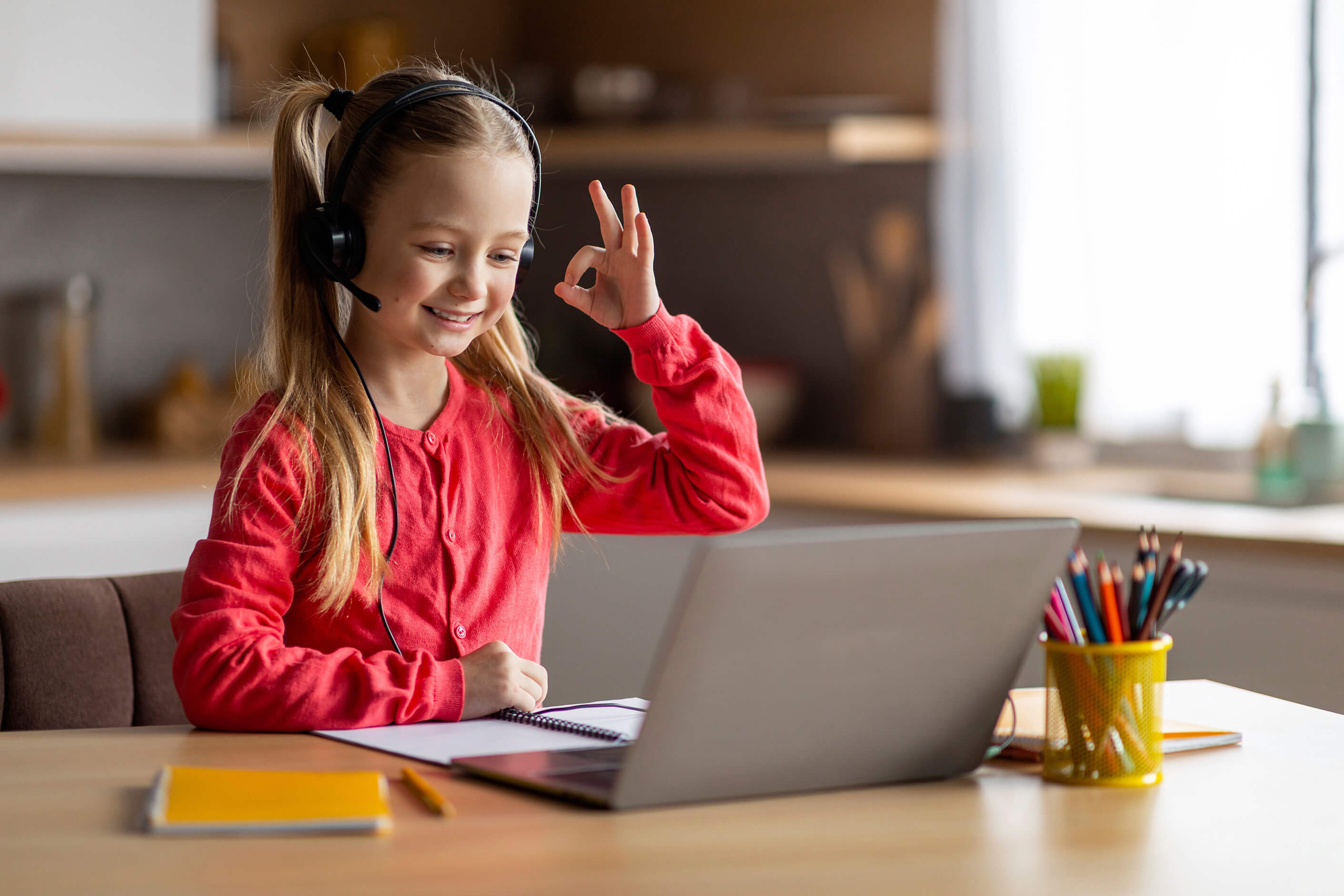A happy girl during online math session