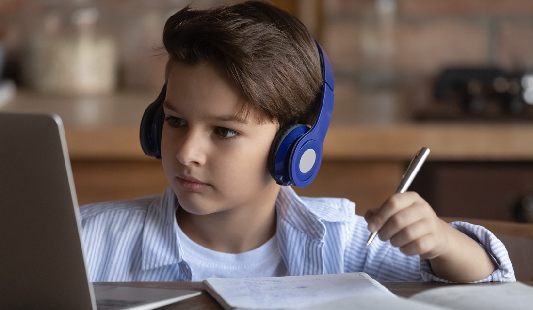 An elementary school student attending an online math class