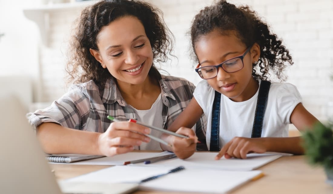 Mom asssissting daughter with math homework