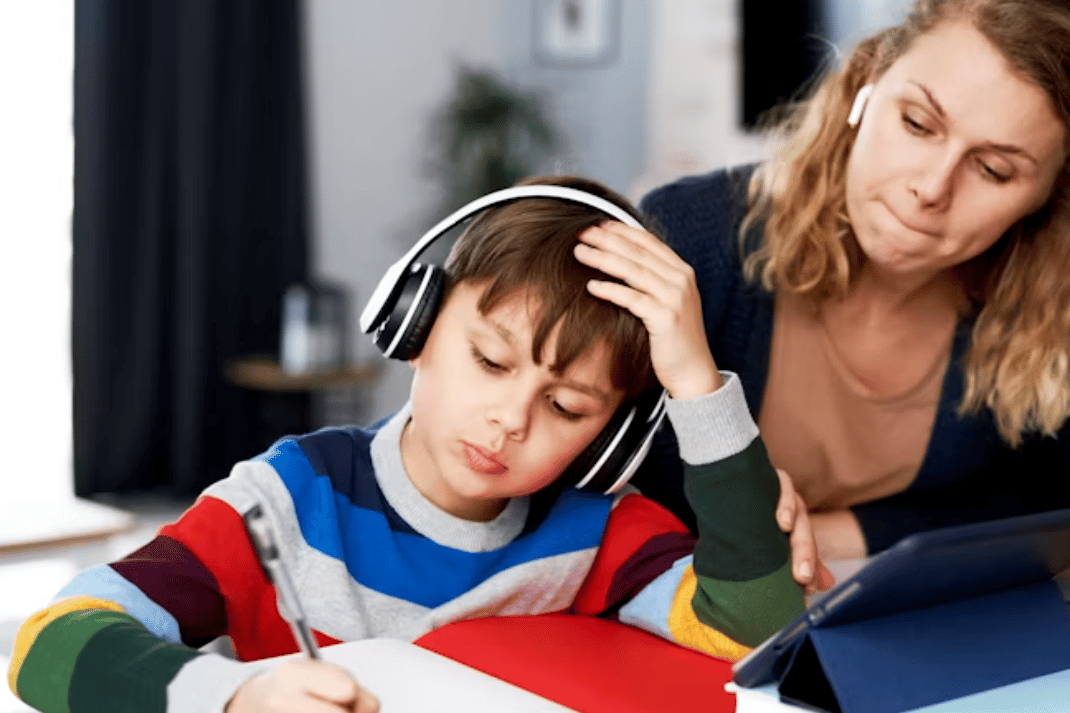 mother doing homework with child