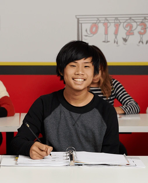 teenage boy smiling in his calculus tutoring class