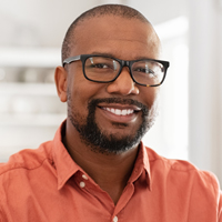 middle-aged man with glasses smiling