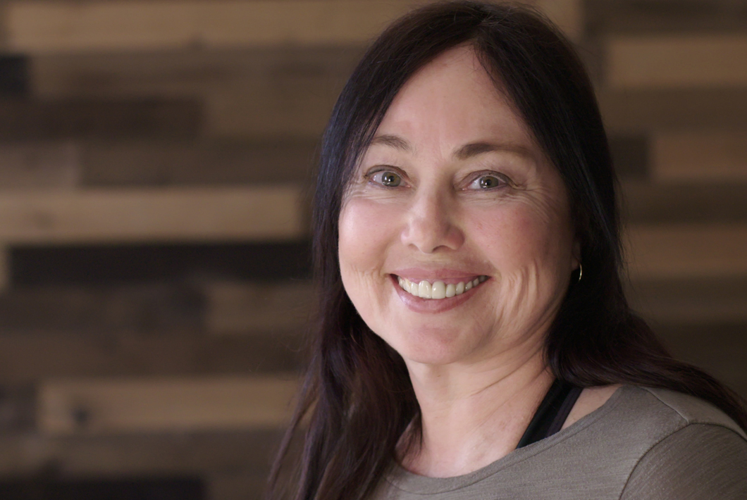 young middle-aged brunette woman smiling