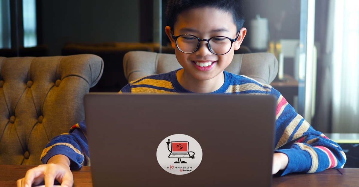 A young boy learning maths online through Mathnasium@home.